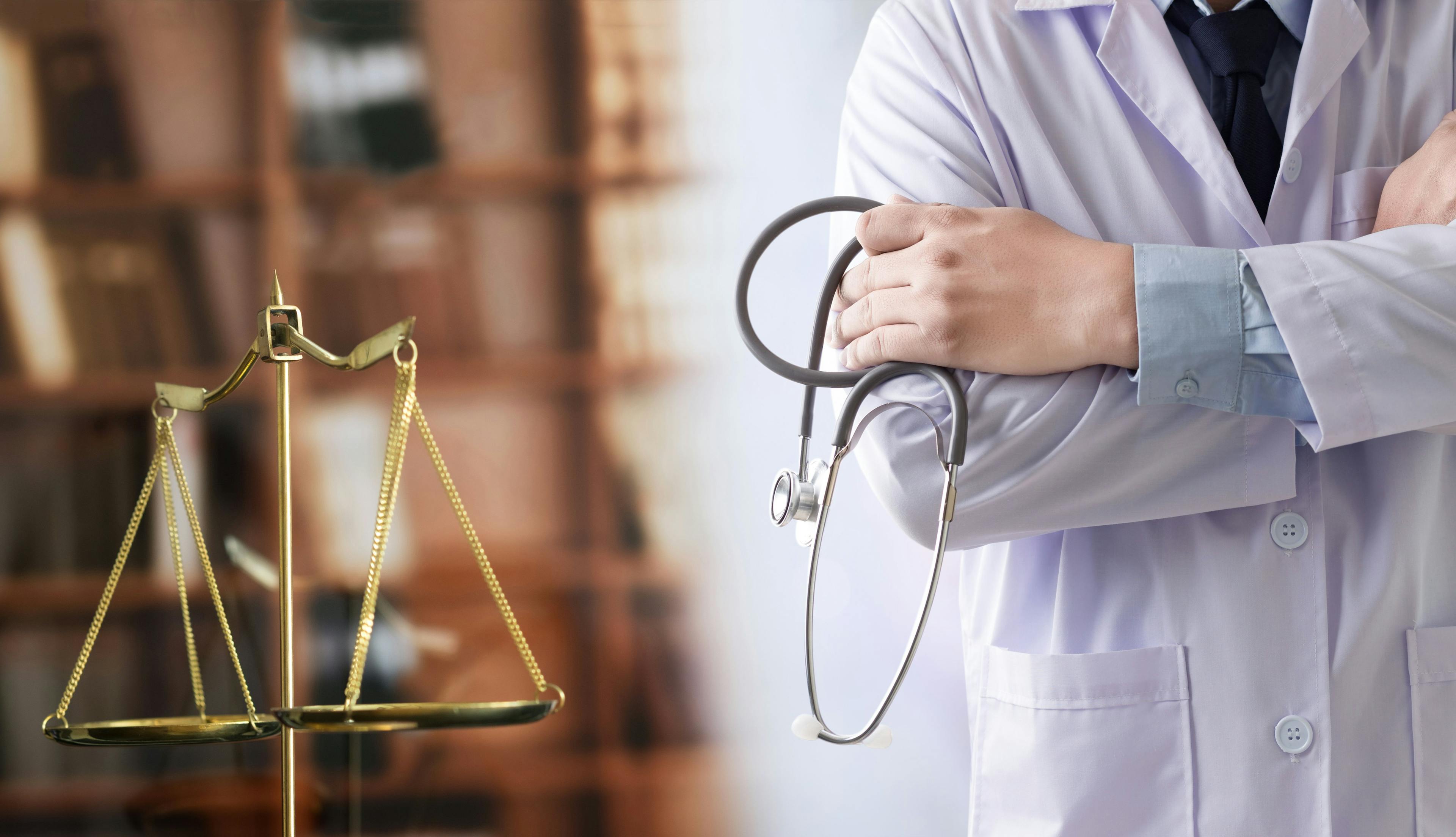 Legal scales and doctor | Image credit: onephoto - stock.adobe.com