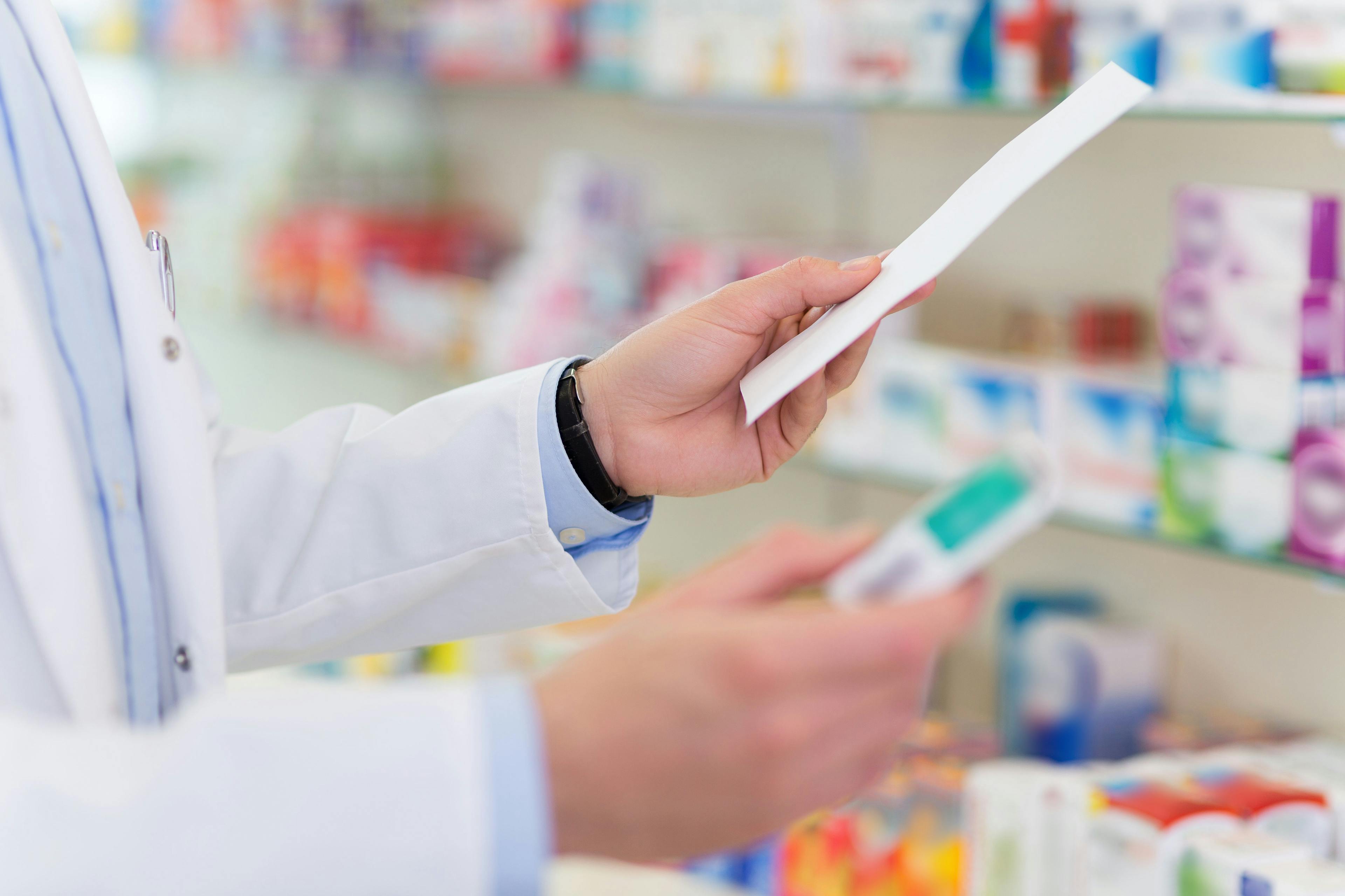 Pharmacist filling prescription in pharmacy | Image Credit: pikselstock - stock.adobe.com