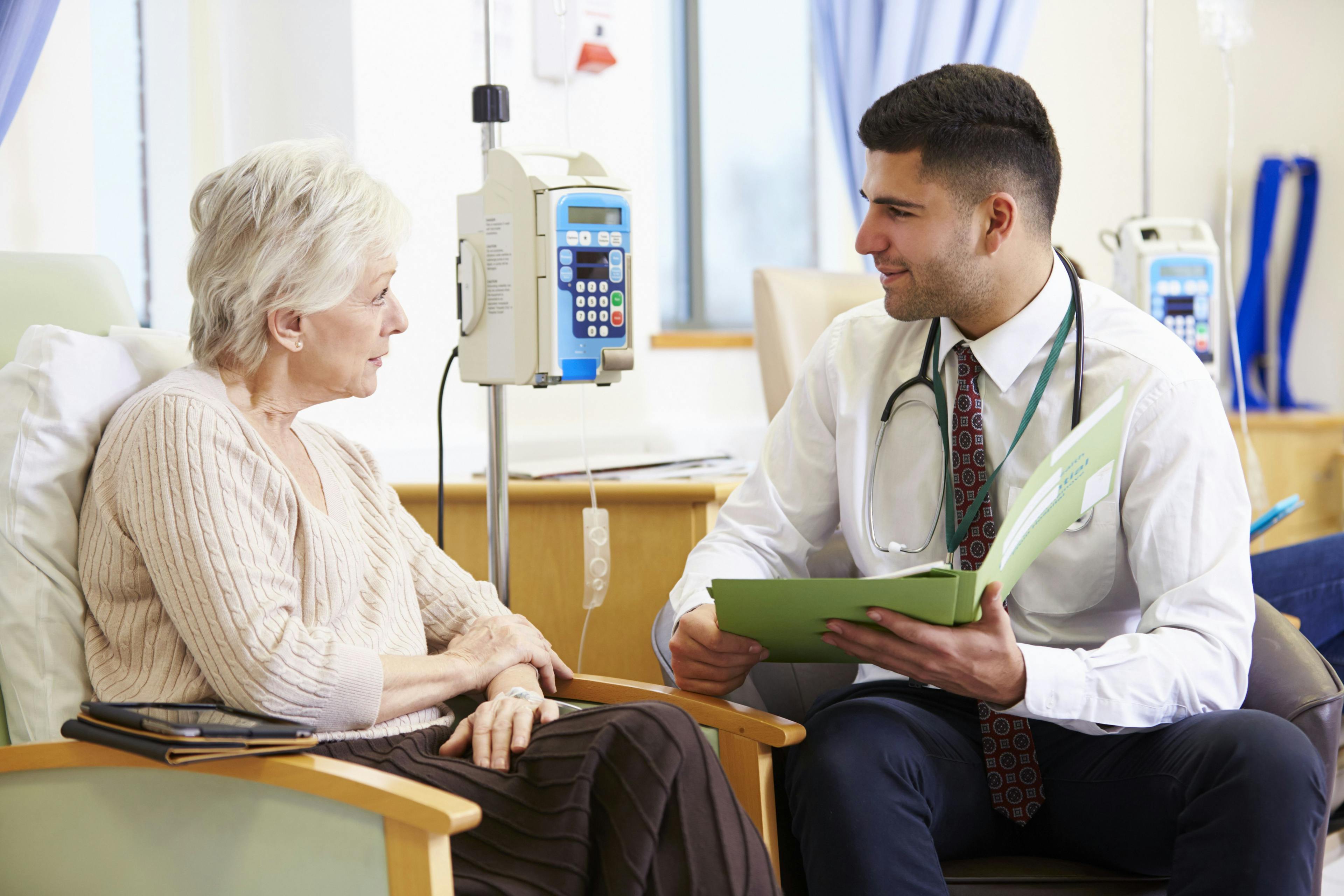 doctor talking to older woman patients receiving chemotherapy
