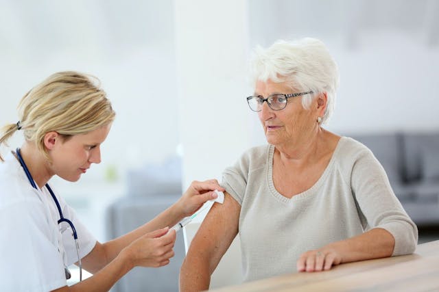 woman receiving subcutaneous injection by a doctor