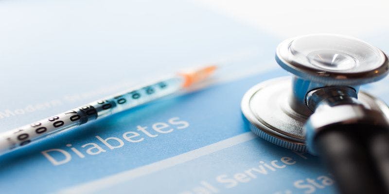 insulin needle on clipboard