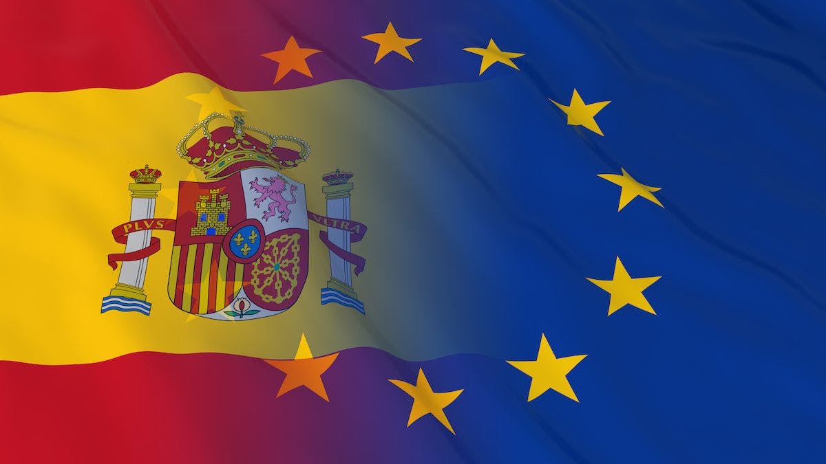Spain flag fade into EU flag | Image credit: Fredex - stock.adobe.com.
