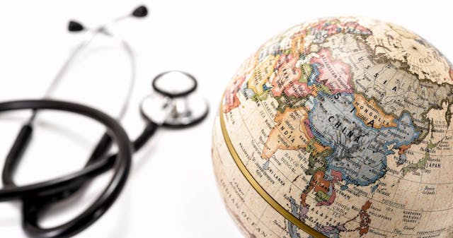globe showing china and a stethoscope